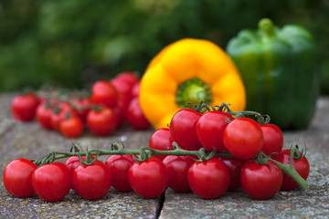 Cherry tomatoes with green and yellow bell peppers