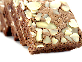 chocolate cake with almonds on white isolated background