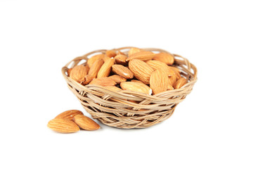 Almonds in basket isolated on white