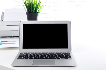 Office open laptop with blank screen