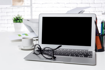 Office open laptop with blank screen