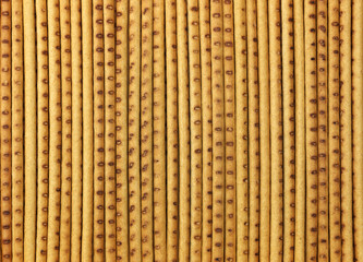 Background in the form of straight long crispy baked straw.