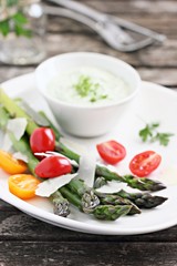 Green asparagus with tomatoes,parmesan and herbs dip. 