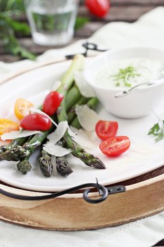 Green asparagus with tomatoes,parmesan and herbs dip. 