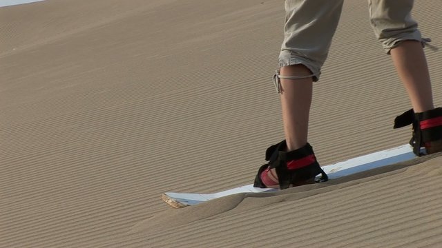 sandboarding in dunes, Ica, Peru
