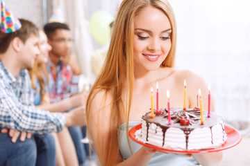 Young girl with her birthday cake