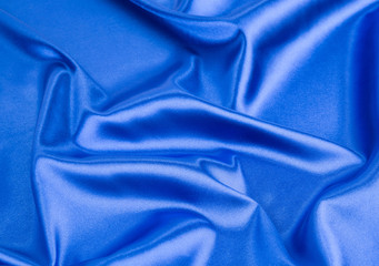 Blue silk cloth texture close up.