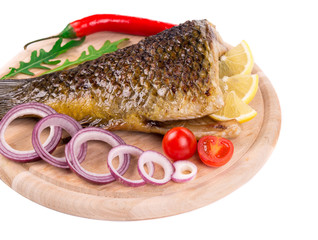 Fried carp tail with lemon and pepper.