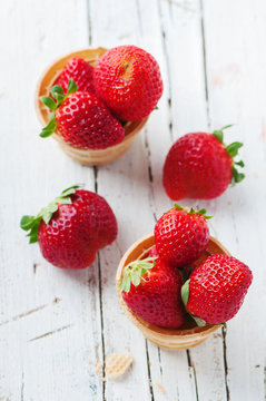 Sweet red strawberry on the wooden table