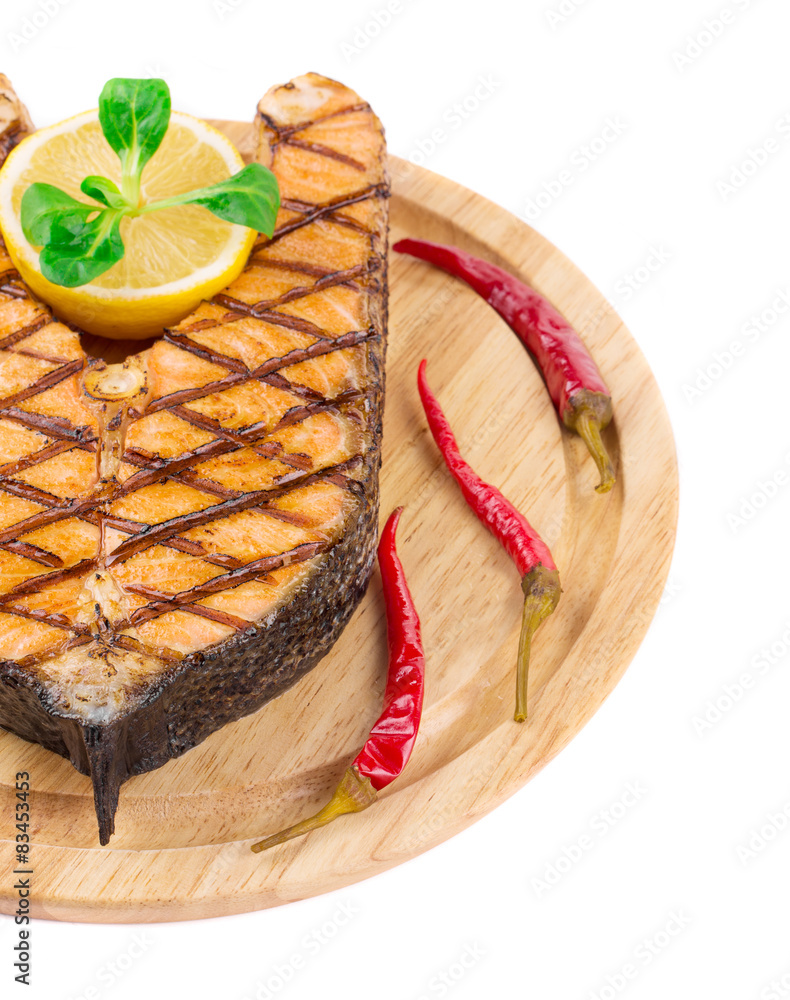 Wall mural grilled salmon steak on platter.