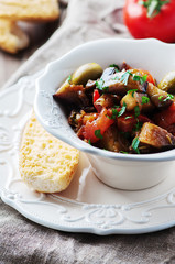 Traditional sicilian dish caponata with eggplant and tomato