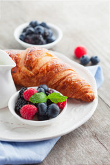 Fresh croissant and berries