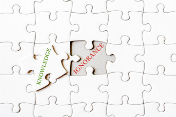 Missing jigsaw puzzle piece with word KNOWLEDGE