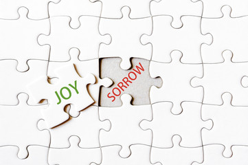 Missing jigsaw puzzle piece with word JOY