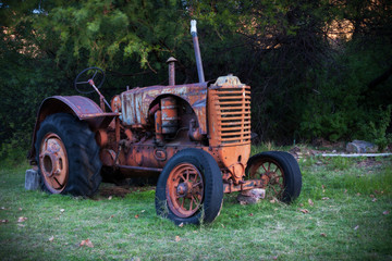 old dilapidated tractor standing in a rusty unused condition