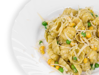Pasta shells with vegetables on white plate