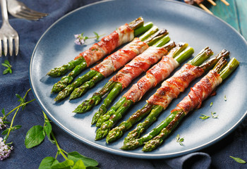 Grilled green asparagus wrapped with bacon