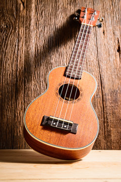 ukulele on wood background