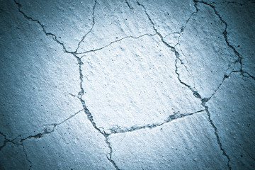 Cracks on the sand. Natural background. Toned