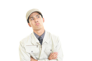 疲れた表情の作業員