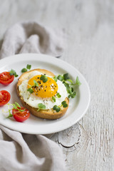 toast with egg on a white plate 
