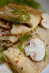 Crepes with the chicken, mushroom, lettuce 