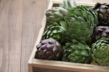 artichokes harvest in wooden box