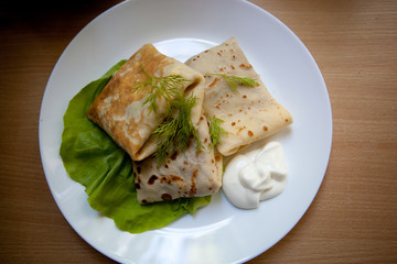 Crepes with the chicken, mushroom, lettuce 