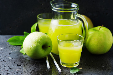 Fresh apple juice and green apples