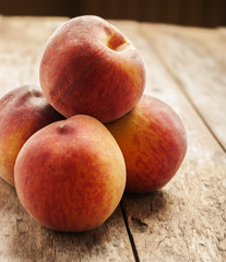 peaches in wooden background