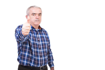 Fototapeta premium Closeup portrait of elderly man showing thumb up