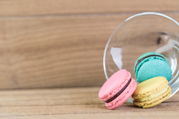 Image Of Colorful French Macarons On Wooden background