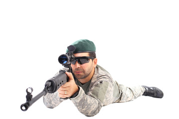 Closeup of young soldier or sniper aiming with a rifl
