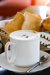 Hot Coffee with Bread in background