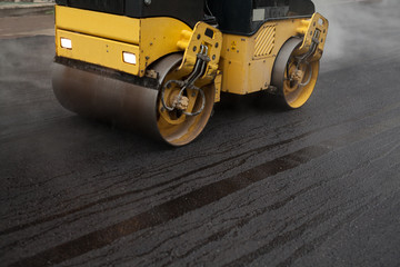 road roller flattening new asphalt