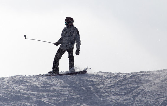 man snowboarding in the snow