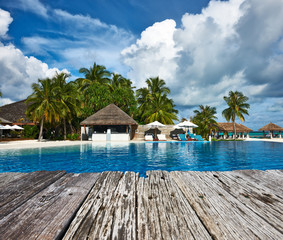 Swimming pool and old wooden pier