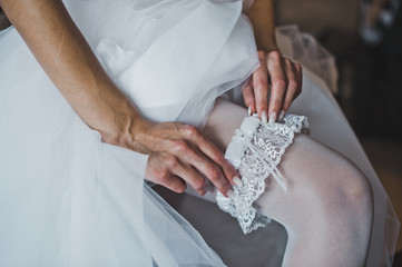 Garter on a foot of the bride 2772.
