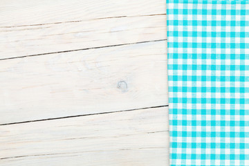 Blue towel over wooden kitchen table