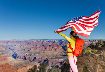 Woman holding US flag, Grand Canyon National Park