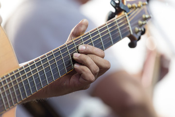 playing guitar on stage