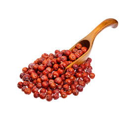 Dry Juniper seed on the wooden spoon.