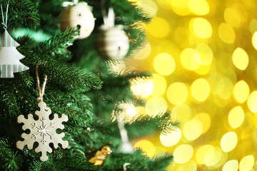 Decorated Christmas tree on blurred, sparkling and fairy background