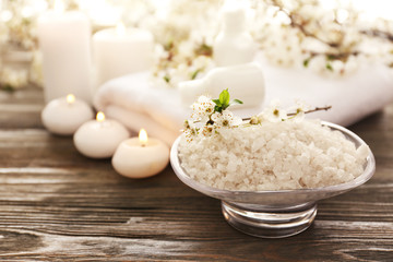 Spa still life with flowering branches on wooden background