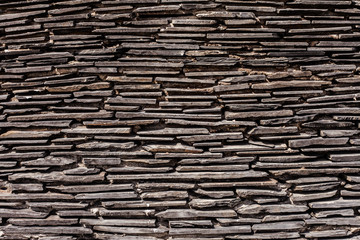 Close up of a brick-wall, Modern black stone texture background.