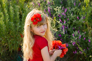 beautiful blond child with flowers