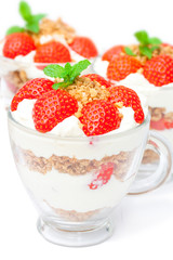 homemade desert with cream chopped cookies and fresh strawberry