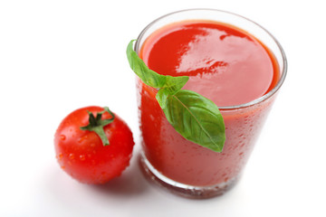 Glass of fresh tomato juice isolated on white