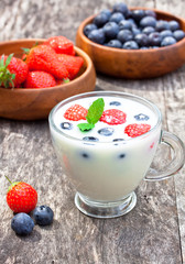 fresh milk with berries on the table