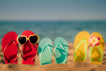 Beach flip-flops on the sand
